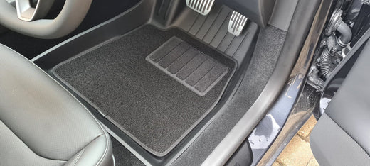 Rubber mats vs. carpet mats: Which choice suits your Tesla?